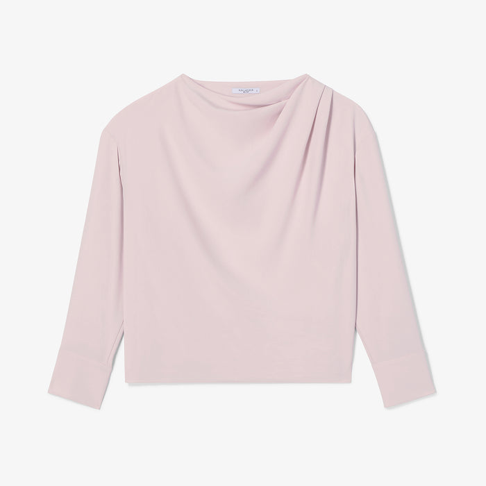 Pink long-sleeve top on a light gray background