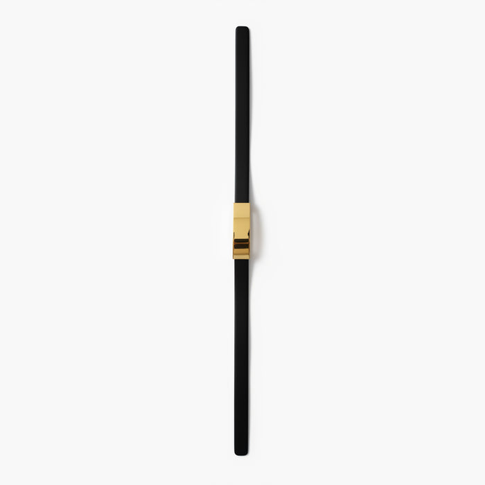Black and gold pen on a white background