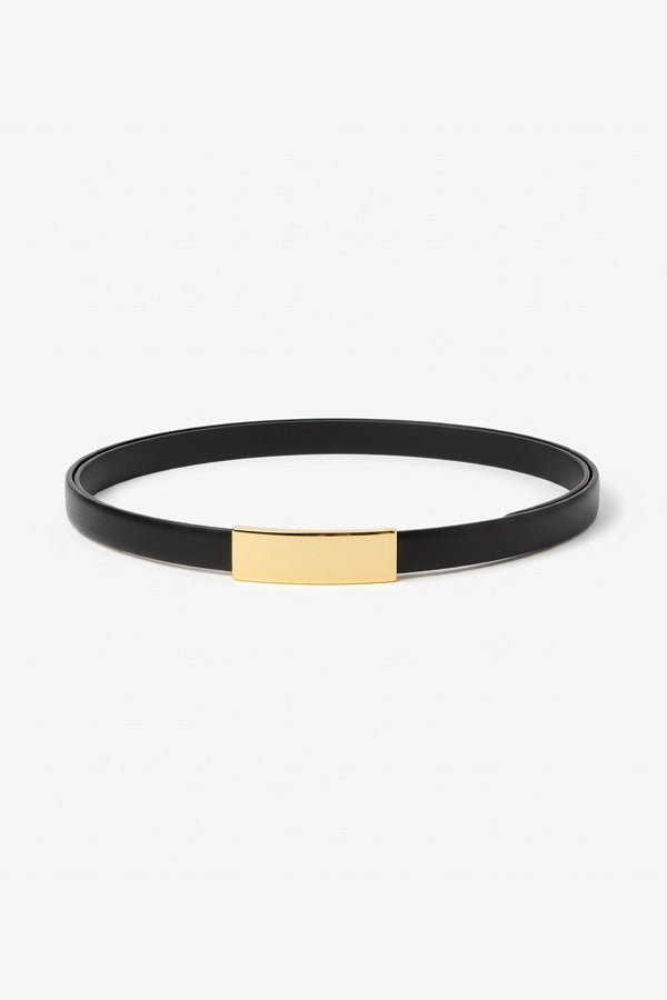 Black leather bracelet with gold accent on a white background | Grid | Exclude