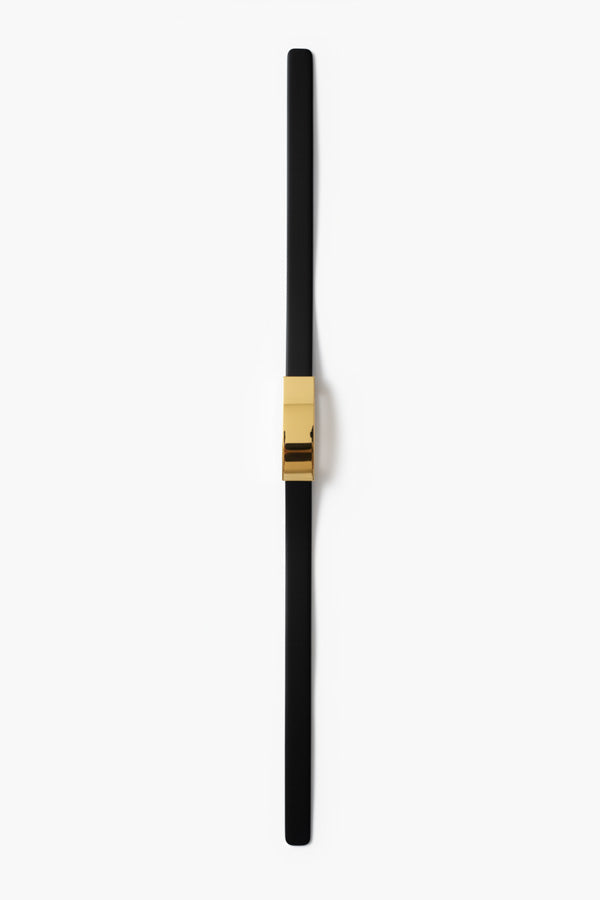 Black and gold cylindrical object on a white background | Grid Hover | Exclude
