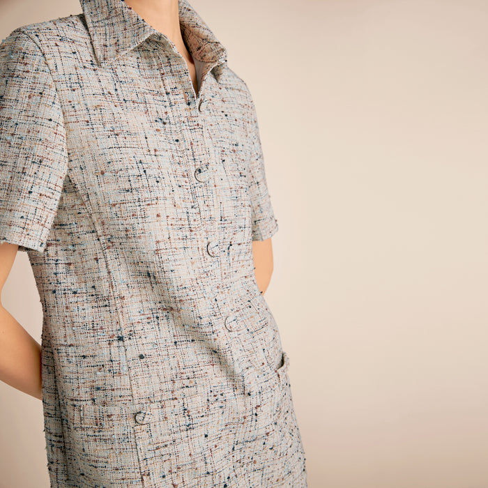 Short-sleeve dress with a pattern on a beige background