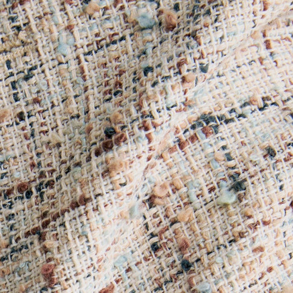 Close-up of a textured fabric with a patterned design. | Exclude | Swatch
