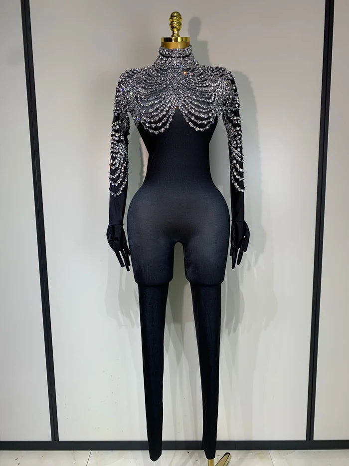 Audre luxury rhinestone stretch jumpsuit with shimmering rhinestones and fitted silhouette.