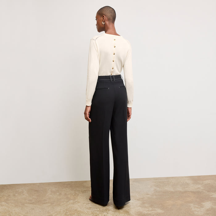 back image of a woman wearing the larissa sweater in ivory