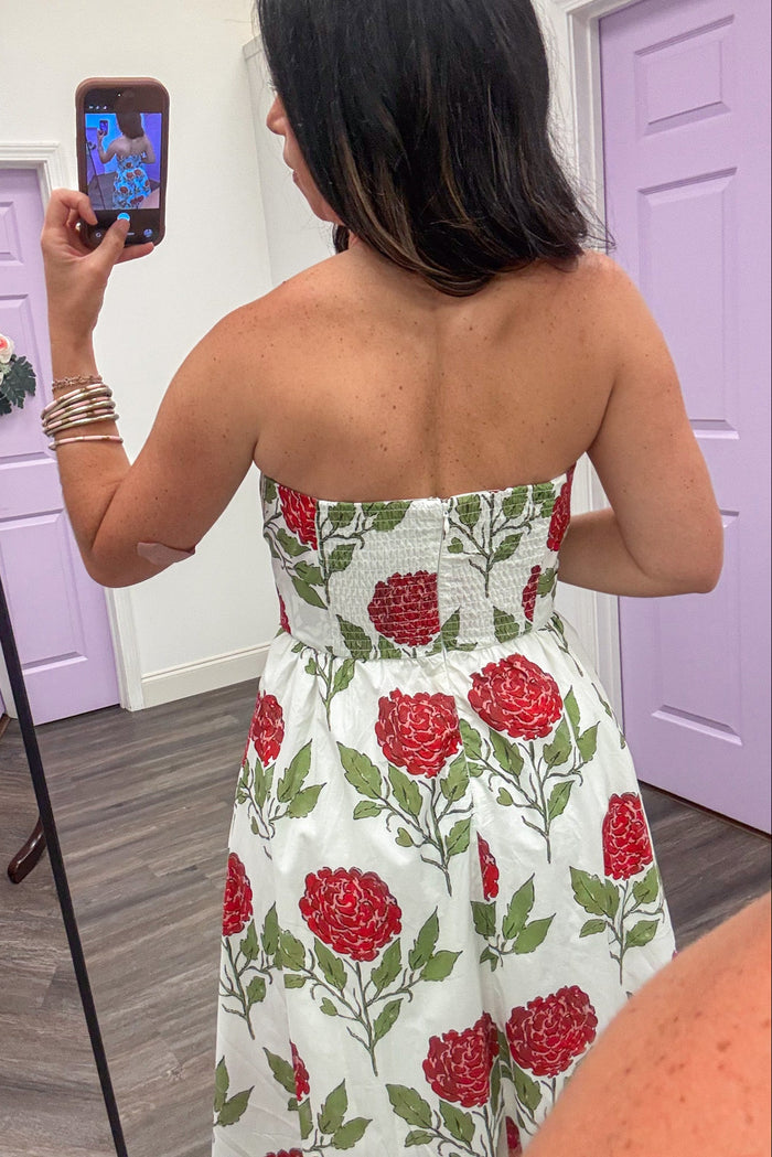 white with red and green large floral print strapless smocked back midi dress