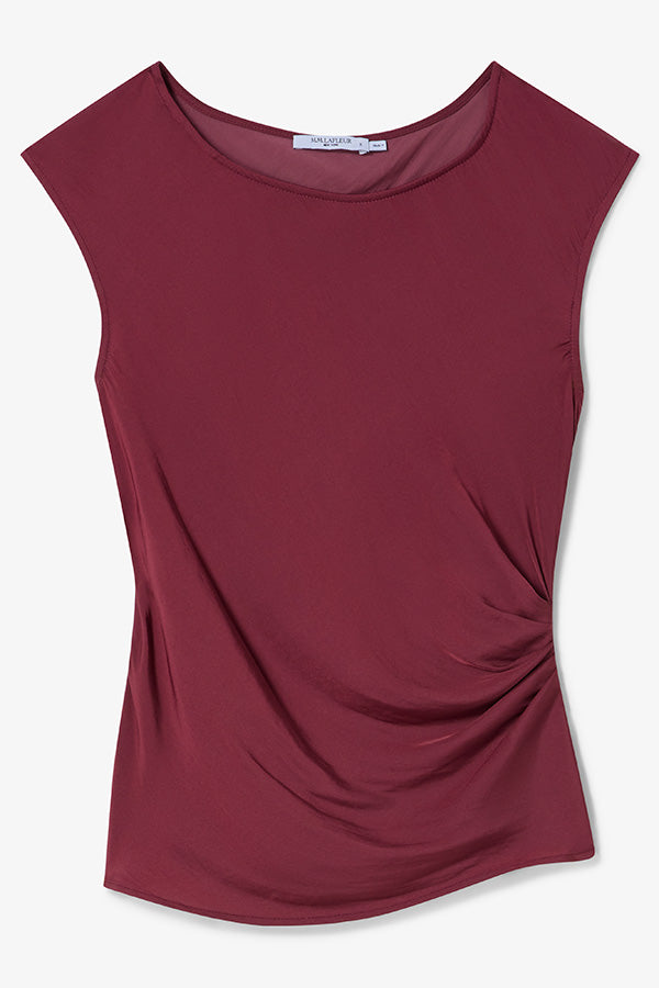 Maroon sleeveless top with a draped design on a white background | Exclude | Still