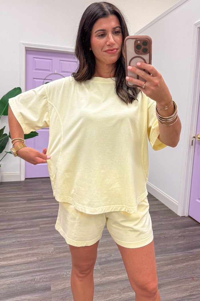 solid washed butter yellow short sleeve crew neckline relaxed silhouette knit top