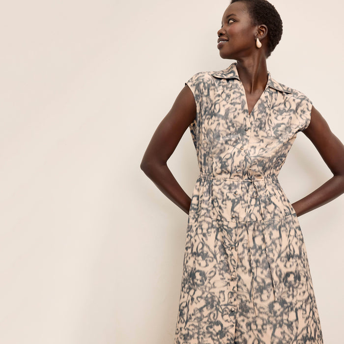 front image of a woman wearing the cira dress in warped floral