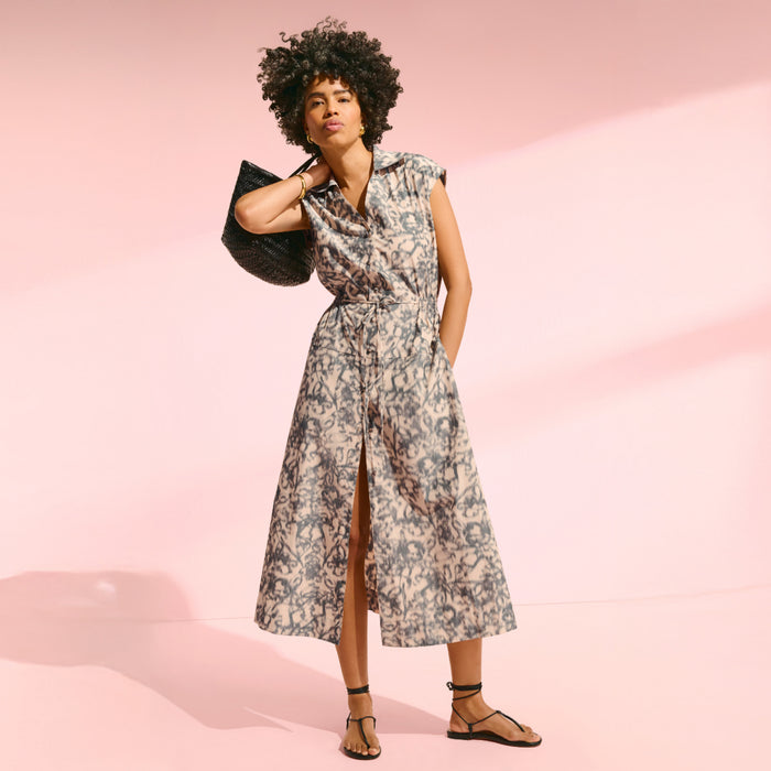 front image of a woman wearing the cira dress in warped floral