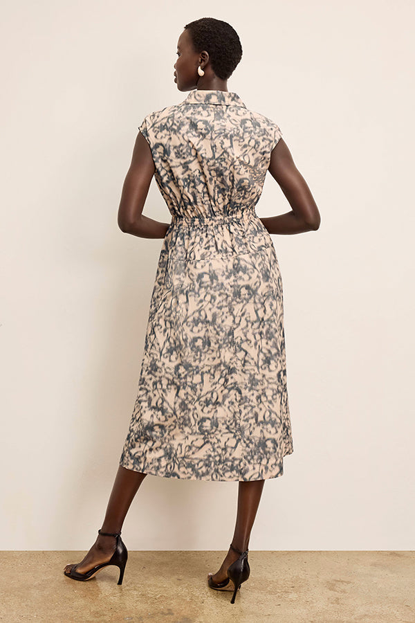 front image of a woman wearing the cira dress in warped floral | Exclude | Grid Hover