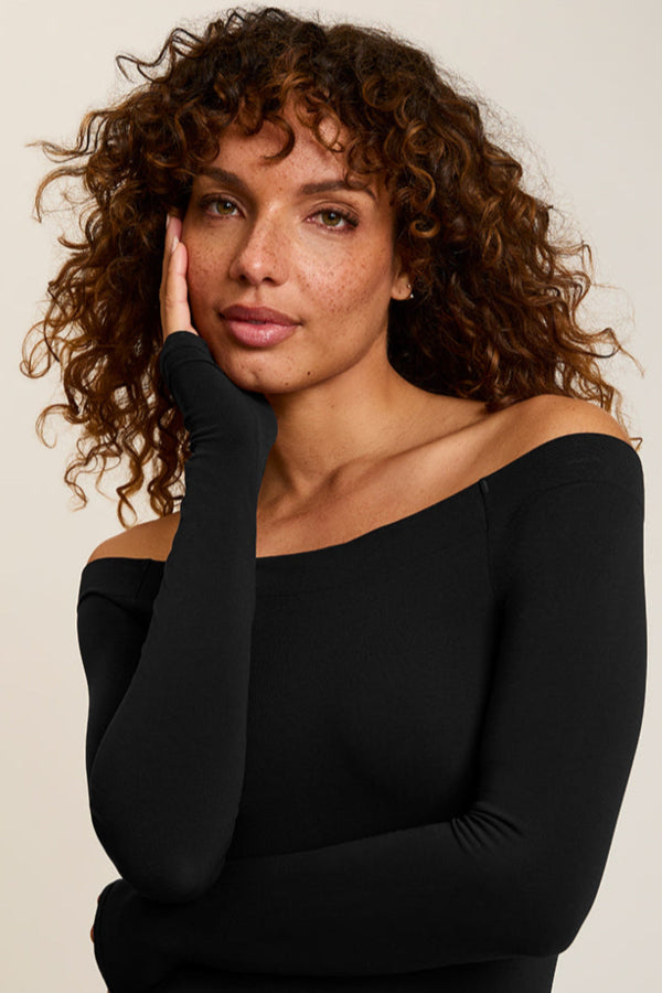 woman wearing black body suit | Grid | Exclude