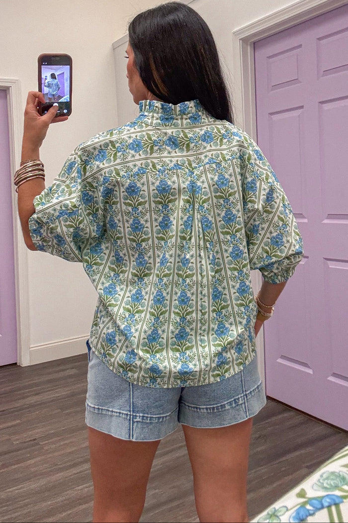blue green and cream floral print button front mock neck short sleeve poplin top