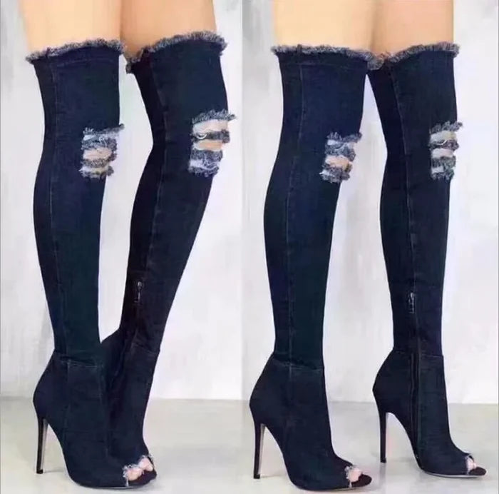 Denim thigh high boots with tassels and high heels.