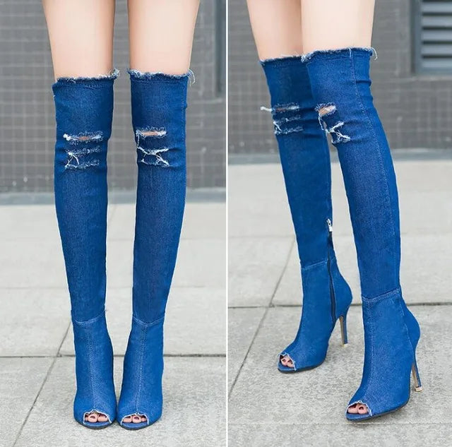 Denim thigh high boots with tassels and high heels.