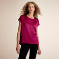 Woman wearing the didion top in dark fuchsia | Lead