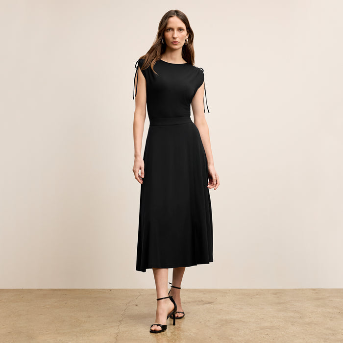 Front image of a woman wearing the Dotty Top in Black