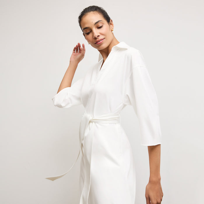 Front image of a woman wearing the Fanfan Dress in White
