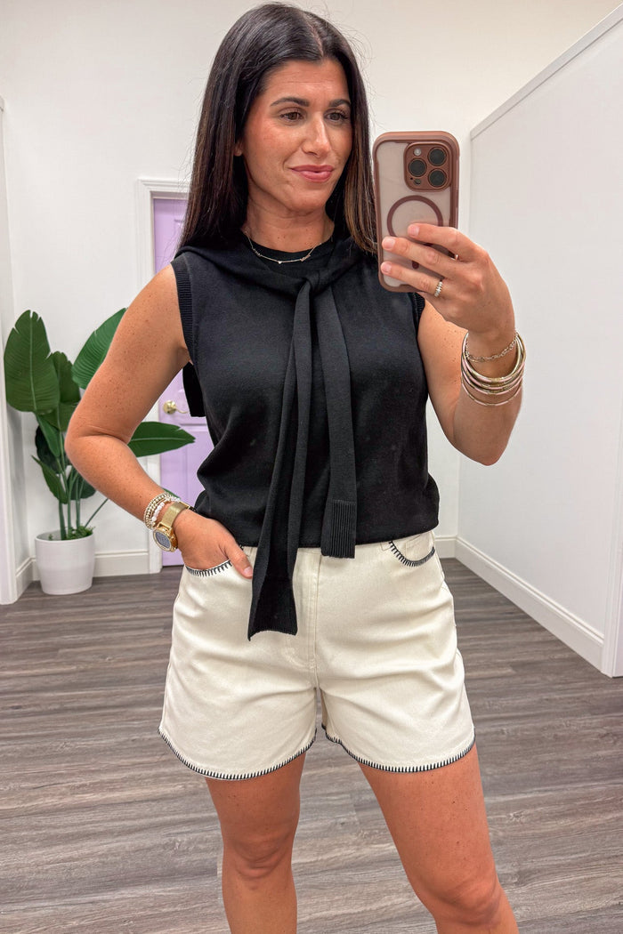solid black sleeveless lightweight knit top with self tie drape scarf