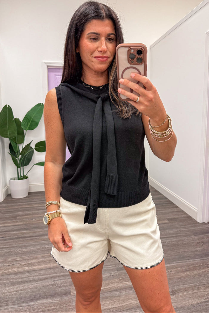 solid black sleeveless lightweight knit top with crew neckline and drape scarf