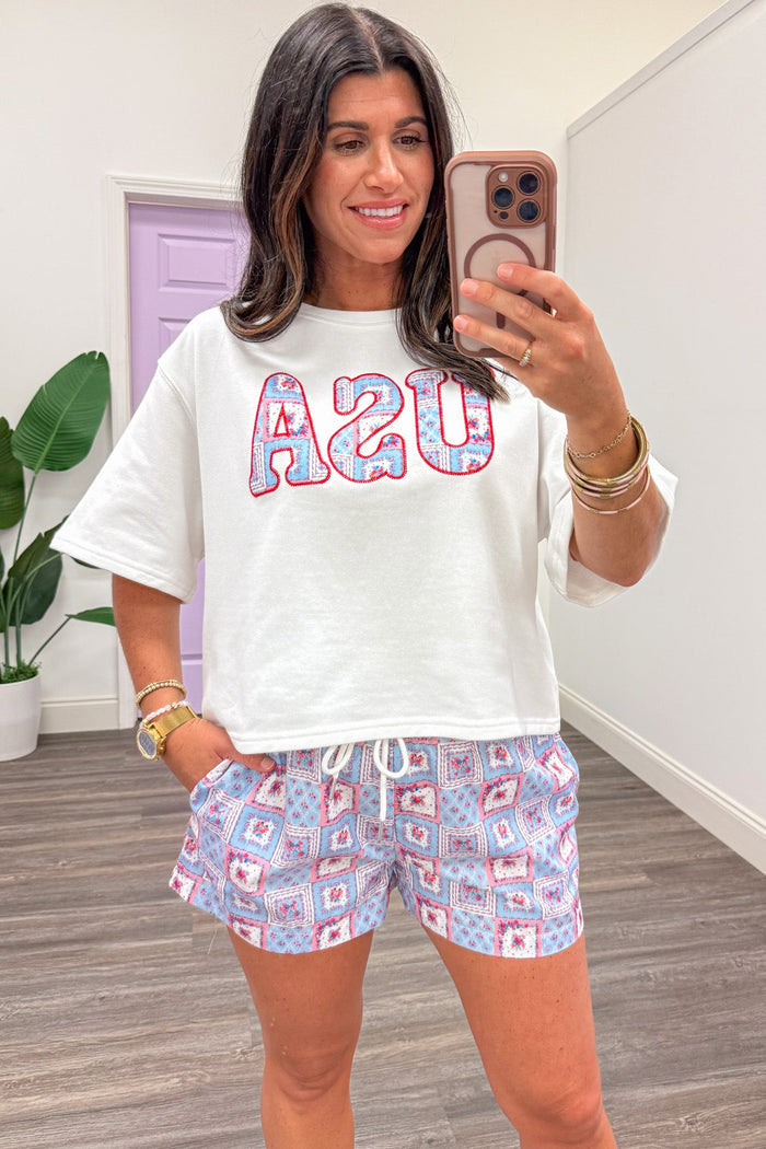 white with embroidered flags and floral patchwork print usa terry knit top