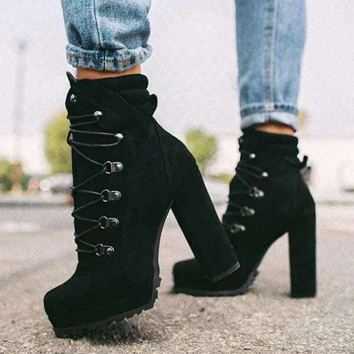 Flock ankle boots with rivets and a square high heel.