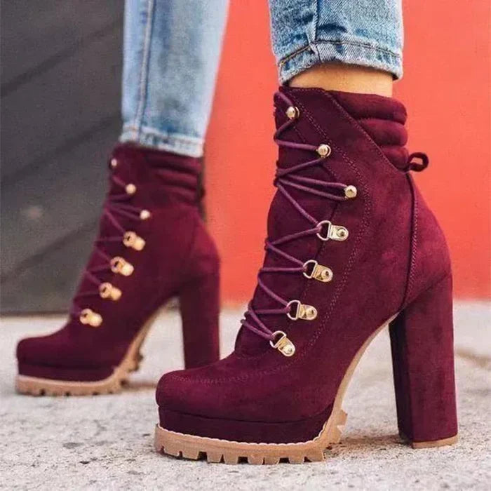 Flock ankle boots with rivets and a square high heel.