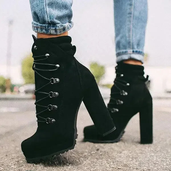 Flock ankle boots with rivets and a square high heel.