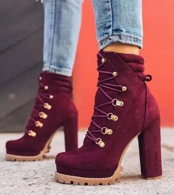 Flock ankle boots with rivets and a square high heel.