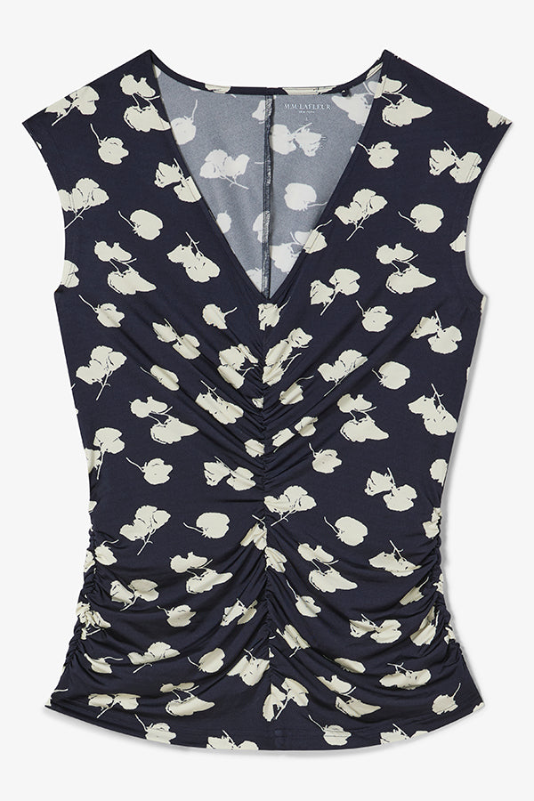 Navy blue sleeveless top with white floral pattern on a white background | Exclude | Still