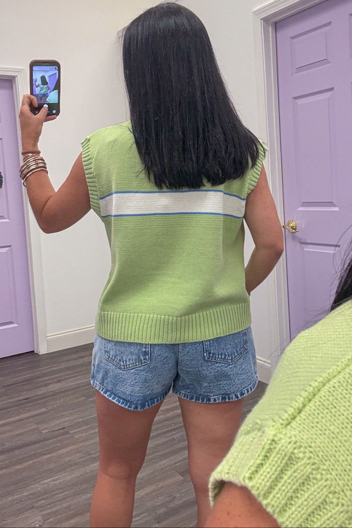lime green with blue and cream stripe detail knit top with ribbed bottom trim