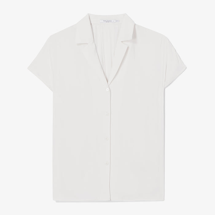 White blouse on a light gray background