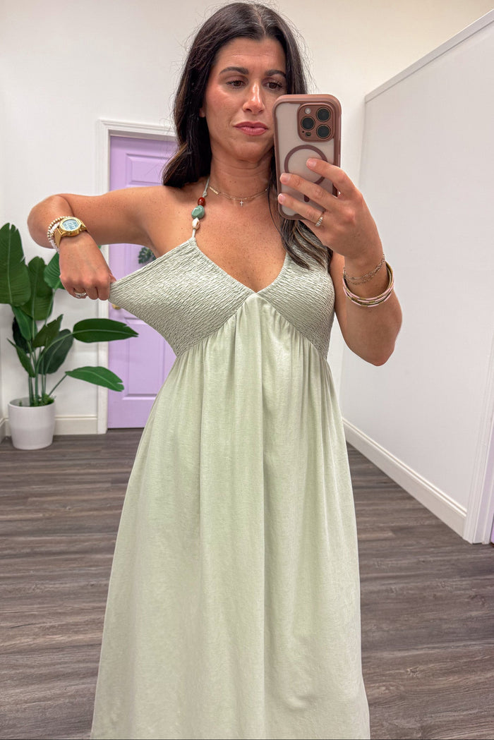 solid dusty sage green sleeveless v neckline smocked bodice halter midi dress