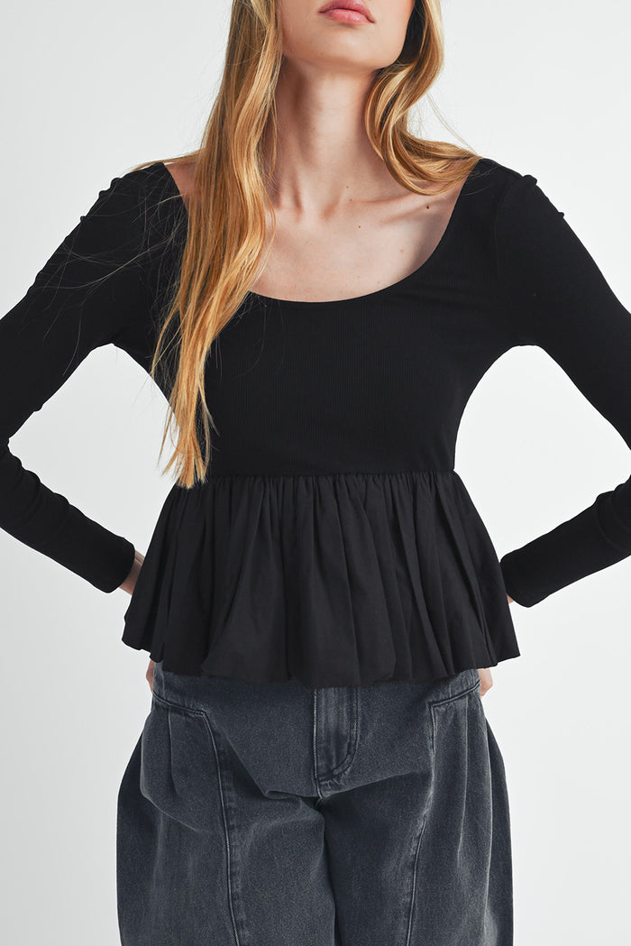 Haut patchwork péplum noir en tricot côtelé à manches longues et encolure dégagée