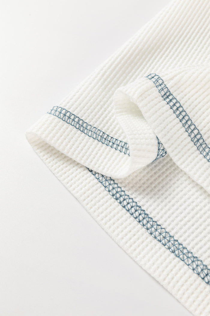 Haut raglan en tricot gaufré à patchwork floral blanc