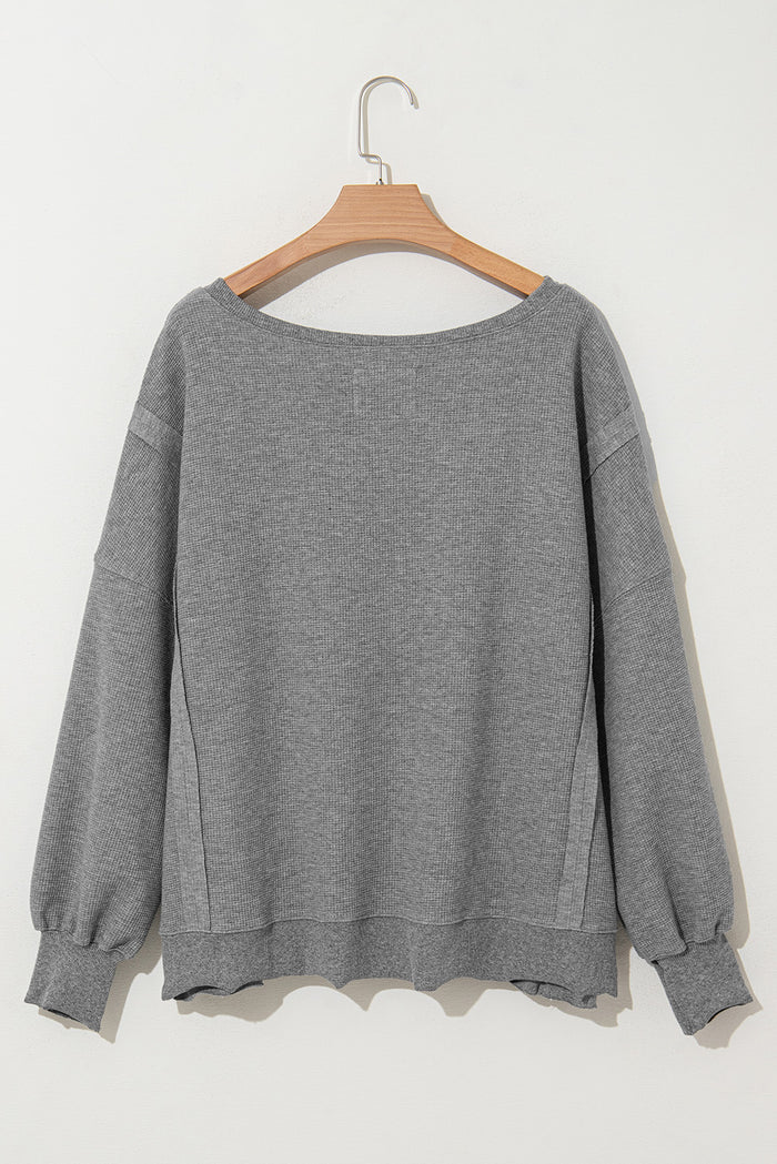 Haut surdimensionné fendu à manches évêque en tricot gaufré gris