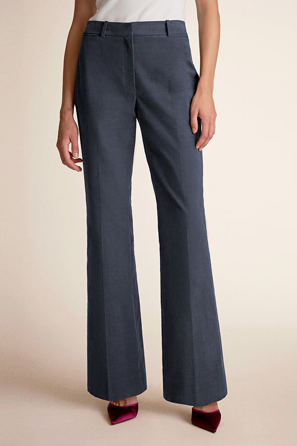 Dark gray wide-leg pants worn by a person on a beige background | Grid | Exclude