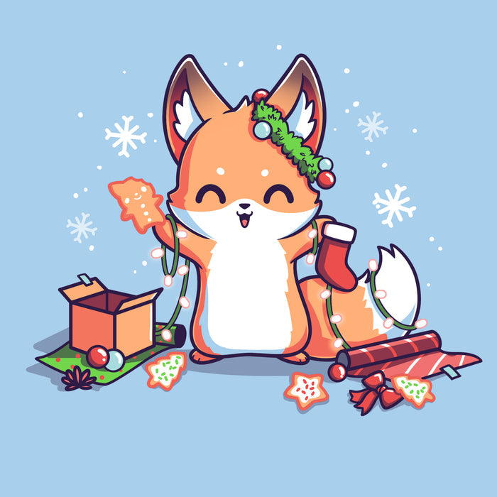 Premium Cotton T-shirt_TeeTurtle It's That Time of Year light blue t-shirt featuring a cheerful fox with green garland around its left ear surrounded by snowflakes and holding a red holiday stocking in one hand a Christmas cookie and a string of lights in the other. On the floor is red gift wrap, a red bow, Christmas cookies and a brown box on top of green gift wrap.