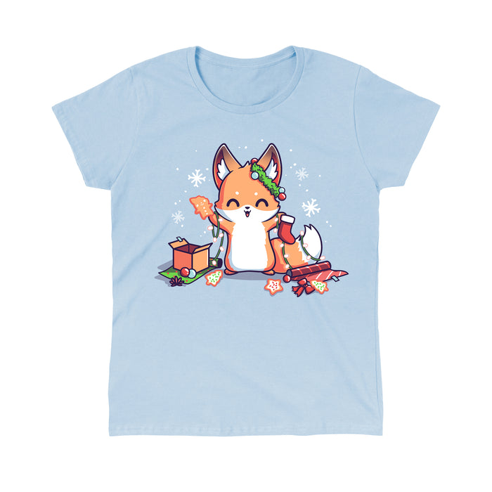 Classic Cotton T-shirt_TeeTurtle It's That Time of Year light blue t-shirt featuring a cheerful fox with green garland around its left ear surrounded by snowflakes and holding a red holiday stocking in one hand a Christmas cookie and a string of lights in the other. On the floor is red gift wrap, a red bow, Christmas cookies and a brown box on top of green gift wrap.