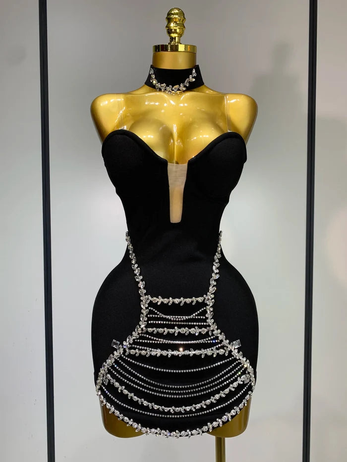 Jamilah strapless mini bodycon dress with rhinestone chain detailing and backless design for women’s birthday or evening parties.