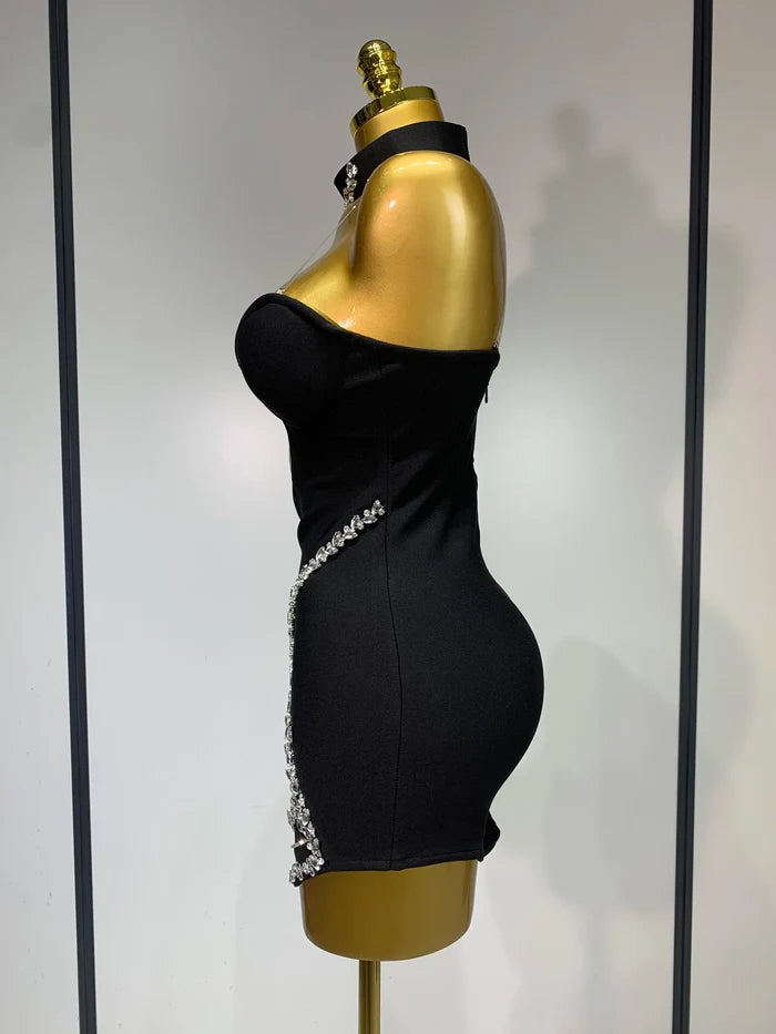 Jamilah strapless mini bodycon dress with rhinestone chain detailing and backless design for women’s birthday or evening parties.