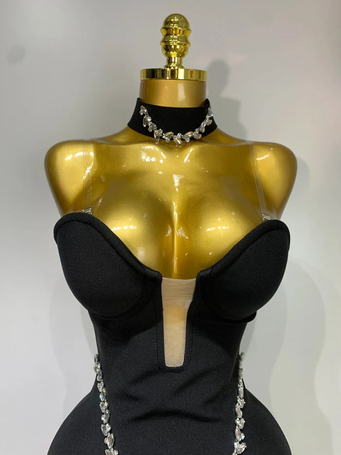 Jamilah strapless mini bodycon dress with rhinestone chain detailing and backless design for women’s birthday or evening parties.