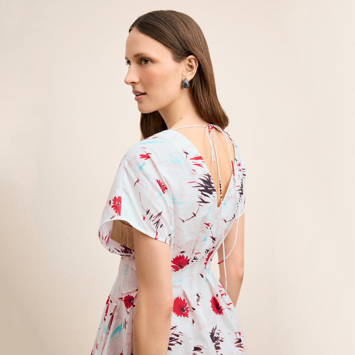 Back image of a woman wearing the Jelina Dress in Brushed Floral