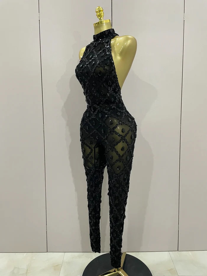 Journee wearing a luxury sparkly black diamond mesh see through jumpsuit.