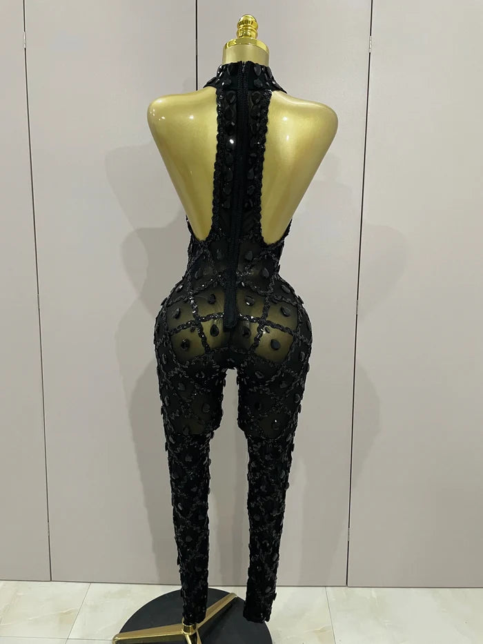 Journee wearing a luxury sparkly black diamond mesh see through jumpsuit.