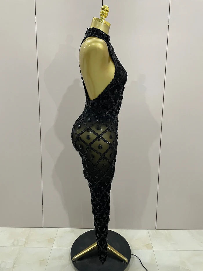 Journee wearing a luxury sparkly black diamond mesh see through jumpsuit.