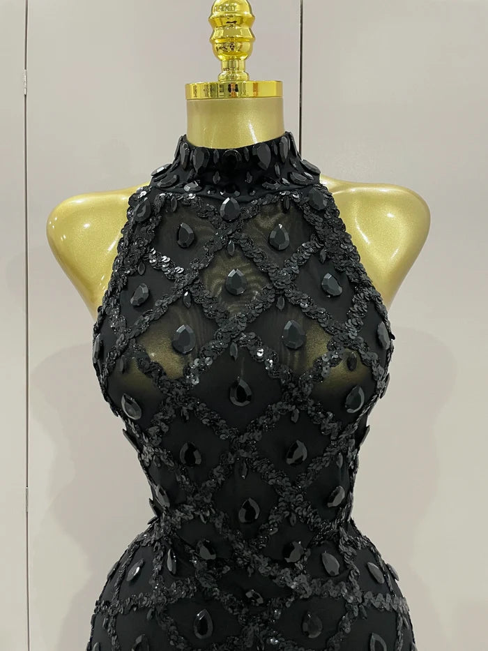 Journee wearing a luxury sparkly black diamond mesh see through jumpsuit.