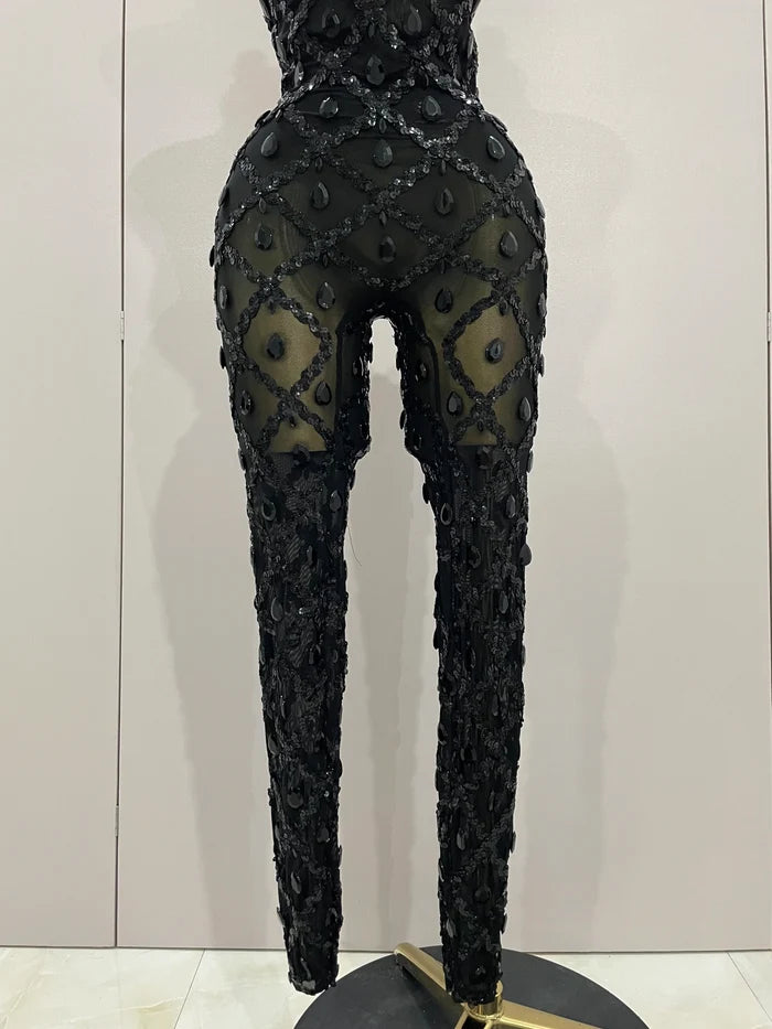 Journee wearing a luxury sparkly black diamond mesh see through jumpsuit.