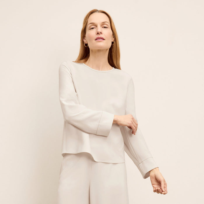 front image of a woman wearing the jules top in eggshell | Lead