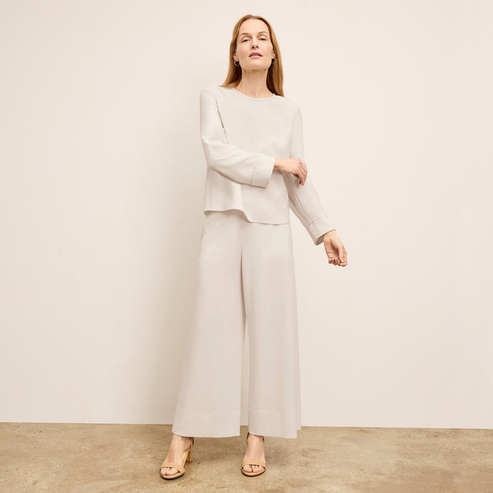 front image of a woman wearing the jules top in eggshell | Exclude