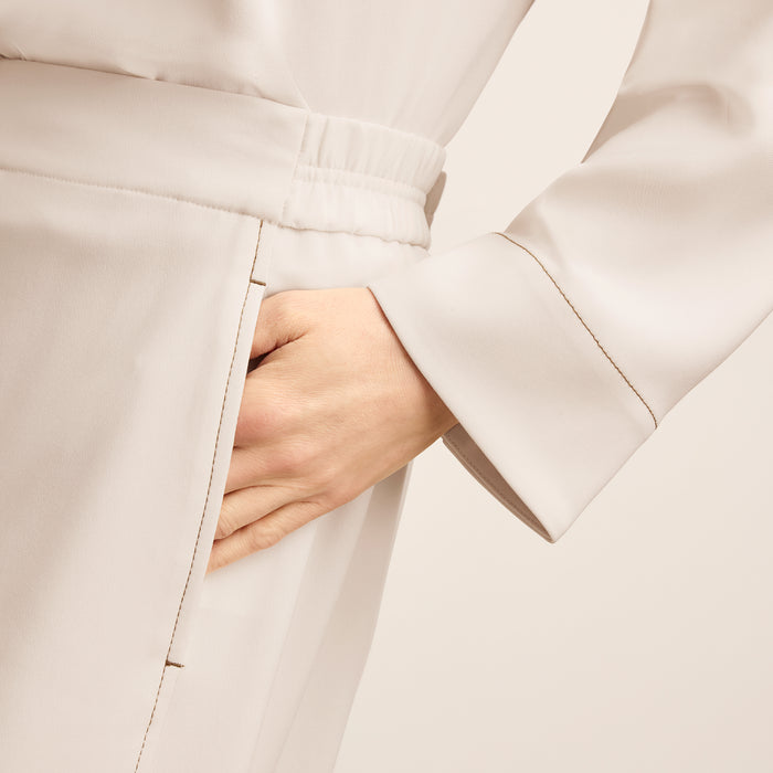 detail image of a woman wearing the jules top in eggshell